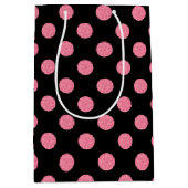 黒い渦巻形の背景にピンクの水玉模様 ミディアムペーパーバッグ (正面)