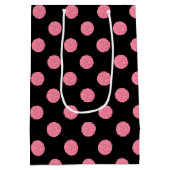 黒い渦巻形の背景にピンクの水玉模様 ミディアムペーパーバッグ (裏面)
