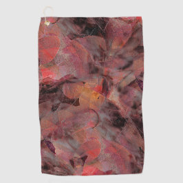 黒い灰色の粒状の背景に赤い色合いの汚れ ゴルフタオル