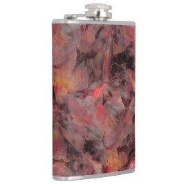 黒い灰色の粒状の背景に赤い色合いの汚れ フラスク