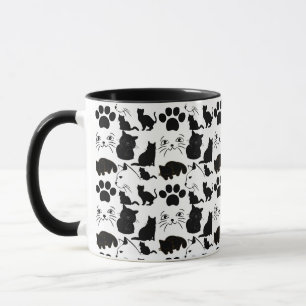 黒い猫の柄を包む紙がピロを投げる マグカップ
