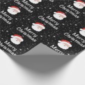 黒い背景にサンタと雪の結晶クリスマス ラッピングペーパー (角)