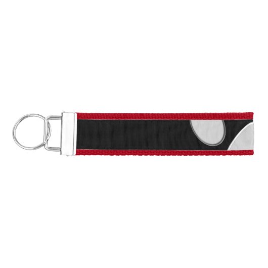 黒い背景にシルバードッグポー リストバンドキーホルダー (鍵左)