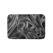 黒い背景に灰色の溝が付いている状態でねじれている バスマット (正面)