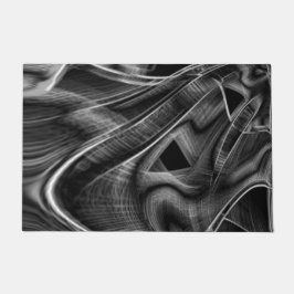 黒い背景に灰色の溝が多く曲がっている ドアマット