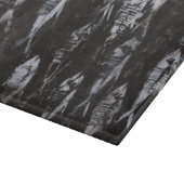 黒い背景の化石の白身魚 カッティングボード (角)