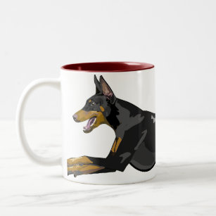 黒い連続したドーベルマン犬 ツートーンマグカップ