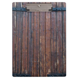 黒い鉄の支えのある古い茶色の木製のドア クリップボード