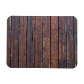 黒い鉄の支えを持つ古い茶色の木製ドア マグネット (横)