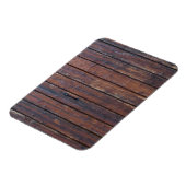 黒い鉄の支えを持つ古い茶色の木製ドア マグネット (左側)