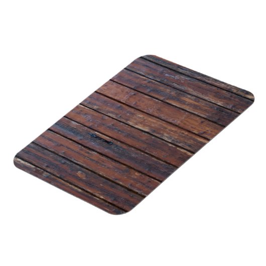 黒い鉄の支えを持つ古い茶色の木製ドア マグネット (左側)