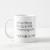 黒おもしろいと白の不機嫌な朝の目覚め引用文 コーヒーマグカップ (左)