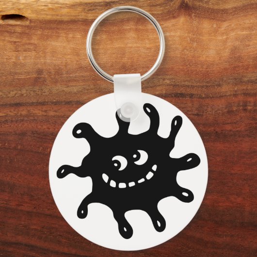 黒おもしろいと白の生殖を微笑む漫画 キーホルダー (正面)