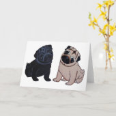 黒および子鹿のパグの子犬の挨拶状 カード (黄色い花)