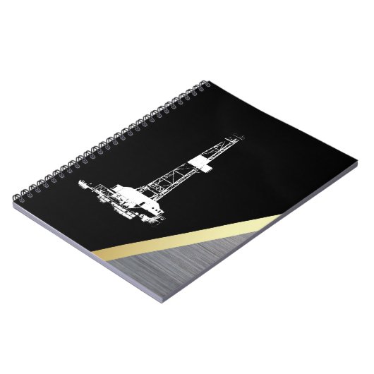 黒および金属の白い掘削装置のシルエット ノートブック (左側)