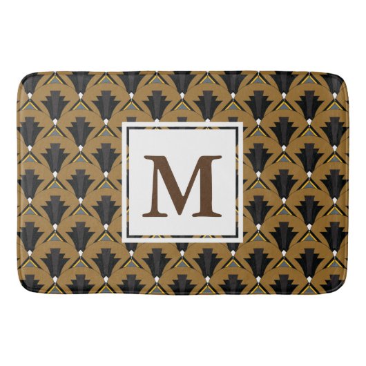 黒く、青銅色のアールデコの幾何学的なモノグラムの バスマット (正面)