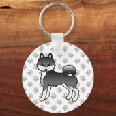 黒と白のアラスカン・クリー・カイ かわいい犬と足 キーホルダー (正面)
