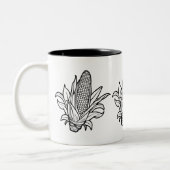 黒と白のコーンのコブのアイコンと離れの ツートーンマグカップ (左)