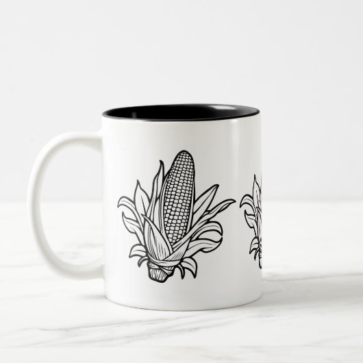 黒と白のコーンのコブのアイコンと離れの ツートーンマグカップ (左)