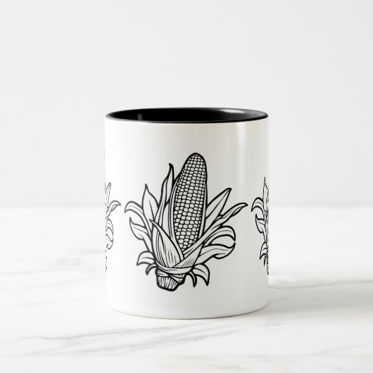 黒と白のコーンのコブのアイコンと離れの ツートーンマグカップ (中央)