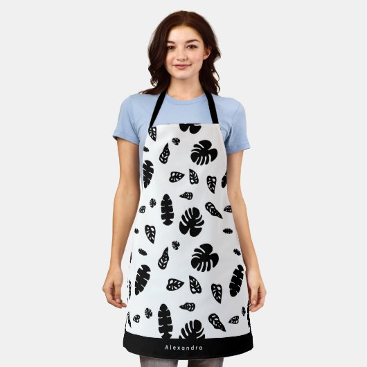 黒と白の熱帯夏離れのパターン エプロン (着用した状態)