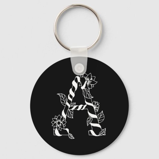 黒と白の花が絡む文字「A」 キーホルダー (裏面)