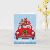 黒のジャーマンシェパードドッグがサンタクロースと一緒に車に乗っている カード (黄色い花)