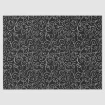 黒の上での白いスクロールカーブ