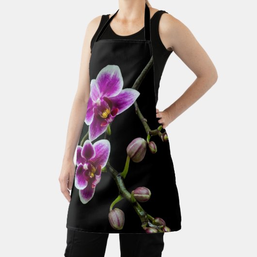 黒の穏やかな上に蘭のピンクの白淡い色の色 エプロン (インサイチュ)