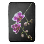 黒の穏やかな上に蘭のピンクの白淡い色の色 バスマット (正面縦)