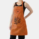 黒ハーブモチーフの焦げオレンジ調の生地 エプロン (インサイチュ)