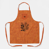 黒ハーブモチーフの焦げオレンジ調の生地 エプロン (正面)