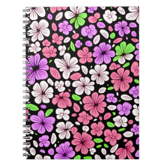 黒地に紫とピンクの花と花びらのパターン ノートブック