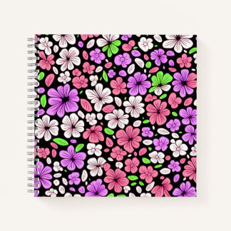 黒地に紫とピンクの花と花びらのパターン ノートブック