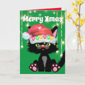 黒猫おもしろいサンタハットの木がユーモアを照らす カード (黄色い花)