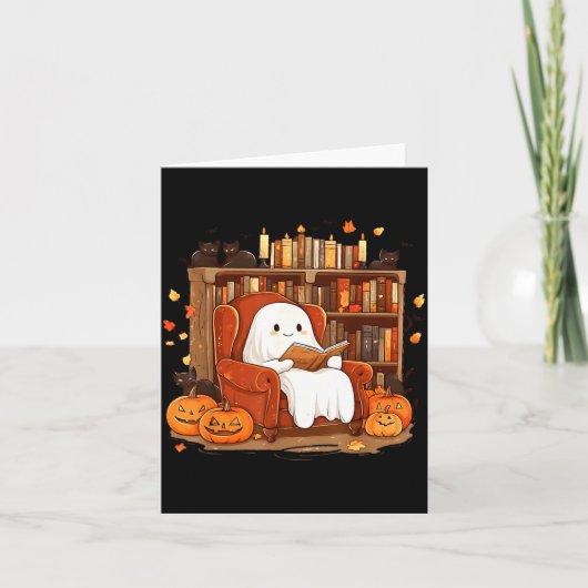 黒猫と本を読む幽霊 かわいいハロウィン カード (正面)