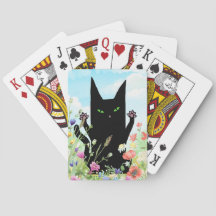 黒猫の春の熱狂: 子猫と花