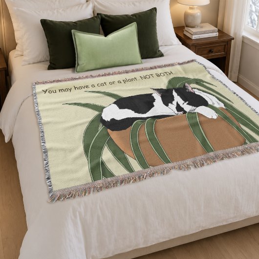 黒白のタキシード猫が観葉植物の上で眠る面白いデザイン スローブランケット