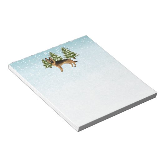 黒褐色のドイツの羊飼い犬の冬の森 ノートパッド (アングル)