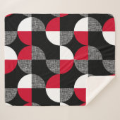 黒、赤、白の幾何学模様。 シェルパブランケット (正面(横))