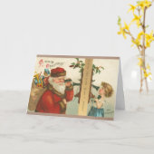 1910年代の小さな少女がサンタにクリスマスの挨拶を呼びかけるビンテージ カード (黄色い花)