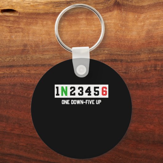 1N23456モーターサイクルシフトバイクもしくは自転車に乗る人 キーホルダー (正面)