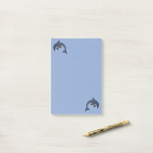 2つのおもしろいマンガタイプのイルカが青い白をジャンプ ポストイット (デスク上)