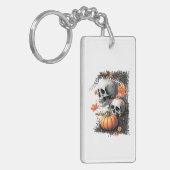 2つのスカルと花の間のカボチャ。 キーホルダー (正面左)