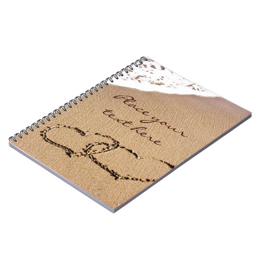 2つのハートが砂の中に ノートブック (左側)