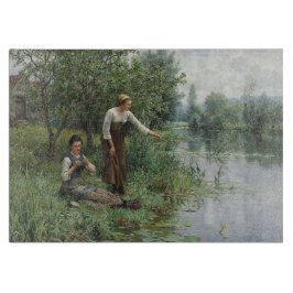 2人の女性魚釣りオンザグラスバイザリバー カッティングボード