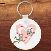 2匹の亀が枝で鳩をする キーホルダー (正面)