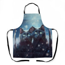 2匹の黒猫が雪に囲まれて