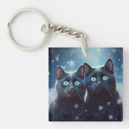 2匹の黒猫が雪に囲まれて キーホルダー