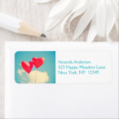 2明るい赤いハート状のバルーン(上に浮かぶ) ラベル (インサイチュ)